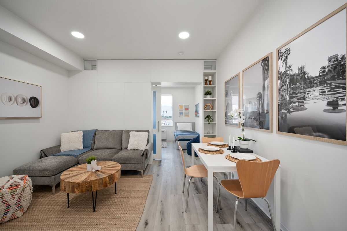 Modern kitchen and living area with quartz countertops